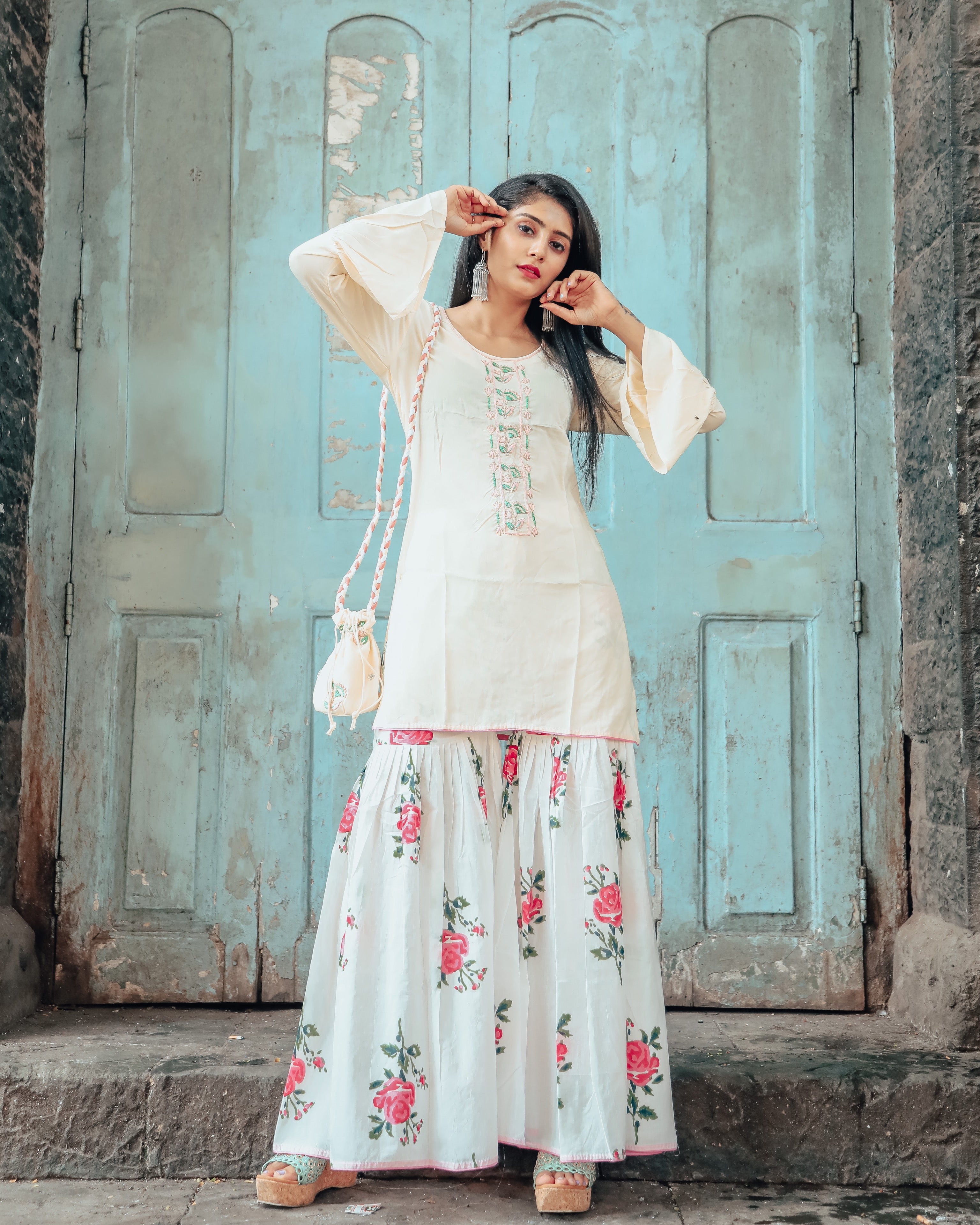 Cream hand embroidered kurta set with beautiful potli