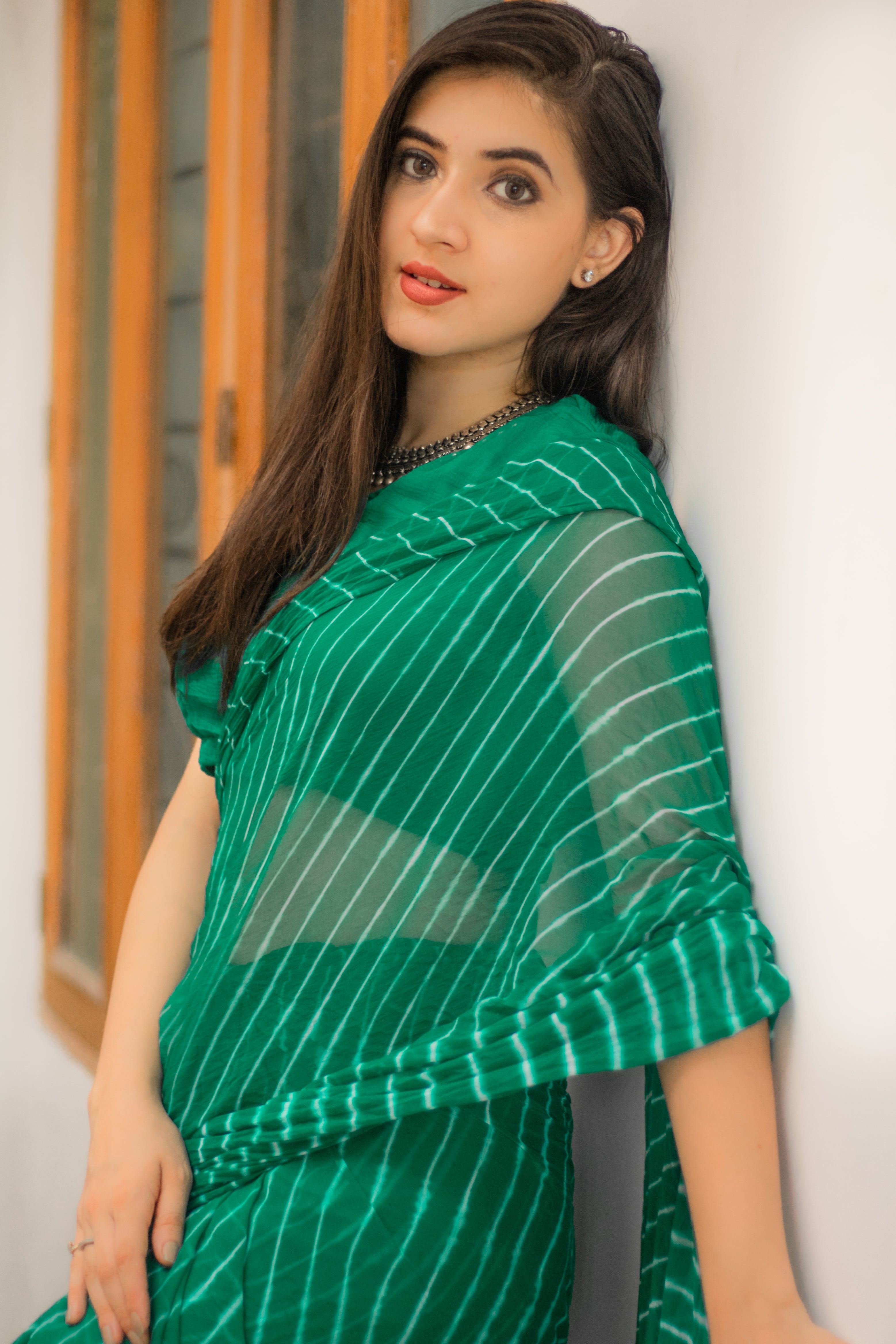 Embellished Rama Green Leheriya saree