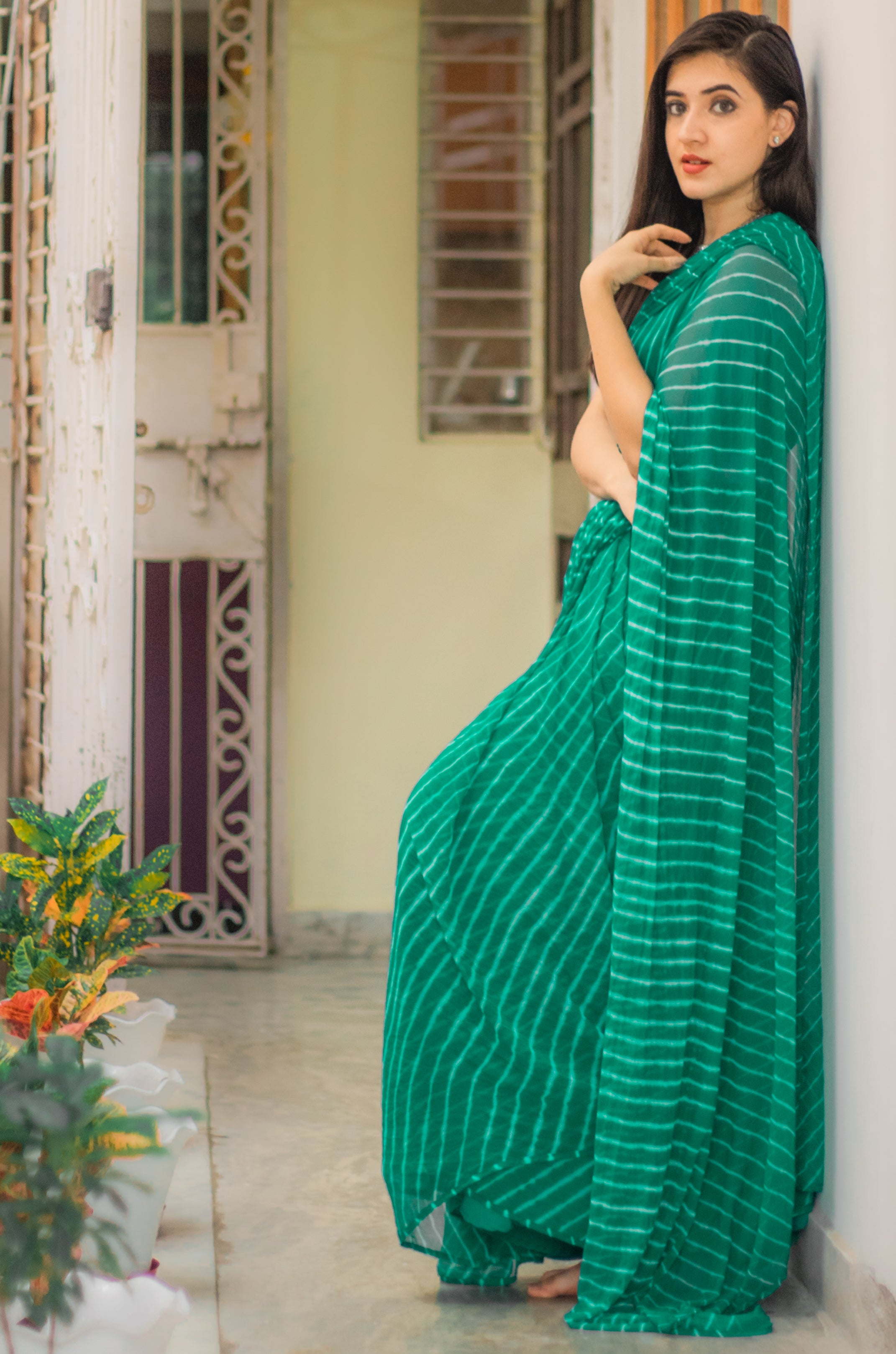 Embellished Rama Green Leheriya saree