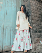 Cream hand embroidered kurta set with beautiful potli